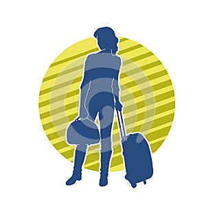 Silhouette of a fashionable female carrying a wheeled luggage travel bag. Silhouette of a business woman doing business trip