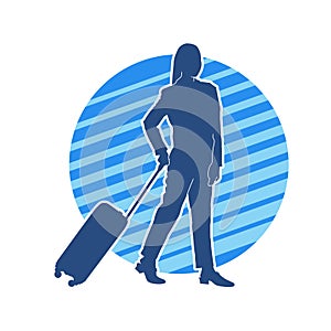 Silhouette of a fashionable female carrying a wheeled luggage travel bag. Silhouette of a business woman doing business trip