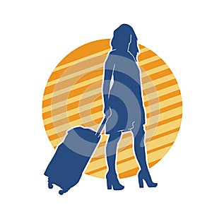 Silhouette of a fashionable female carrying a wheeled luggage travel bag. Silhouette of a business woman doing business trip