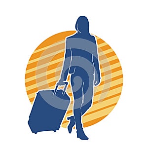 Silhouette of a fashionable female carrying a wheeled luggage travel bag. Silhouette of a business woman doing business trip