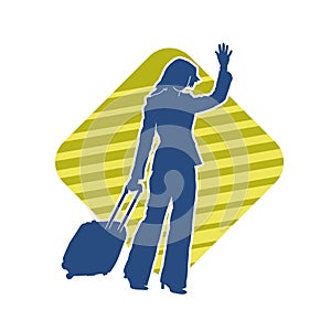 Silhouette of a fashionable female carrying a wheeled luggage travel bag. Silhouette of a business woman doing business trip