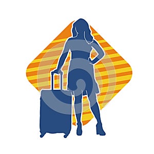 Silhouette of a fashionable female carrying a wheeled luggage travel bag. Silhouette of a business woman doing business trip