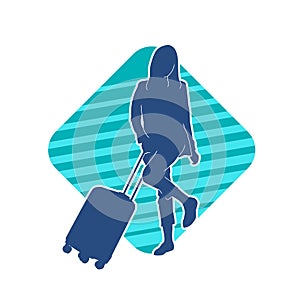 Silhouette of a fashionable female carrying a wheeled luggage travel bag. Silhouette of a business woman doing business trip