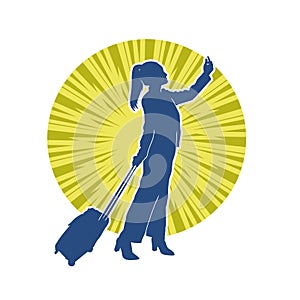 Silhouette of a fashionable female carrying a wheeled luggage travel bag. Silhouette of a business woman doing business trip