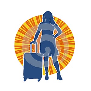 Silhouette of a fashionable female carrying a wheeled luggage travel bag. Silhouette of a business woman doing business trip