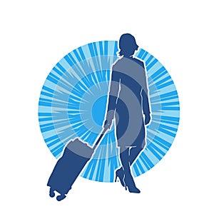 Silhouette of a fashionable female carrying a wheeled luggage travel bag. Silhouette of a business woman doing business trip