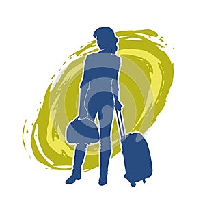 Silhouette of a fashionable female carrying a wheeled luggage travel bag. Silhouette of a business woman doing business trip