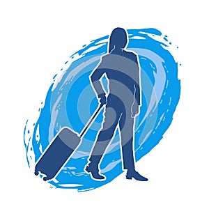 Silhouette of a fashionable female carrying a wheeled luggage travel bag. Silhouette of a business woman doing business trip