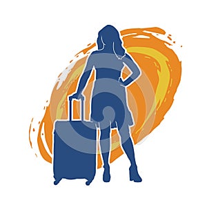 Silhouette of a fashionable female carrying a wheeled luggage travel bag. Silhouette of a business woman doing business trip