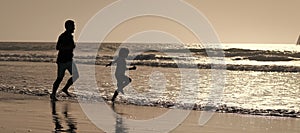 Silhouette of father and son run on summer beach outdoor, banner poster with copy space. Dad and child having fun