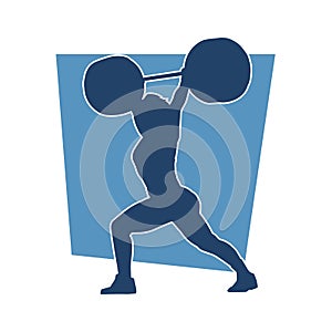 Silhouette of female athlete doing weight lifting sport.