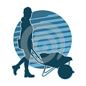 silhouette of a female construction worker pushing a wheelbarrow
