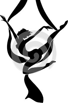 Silhouette of female dancer on aerial silk