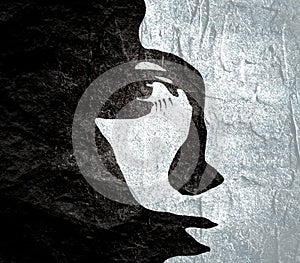 Silhouette of a female head.