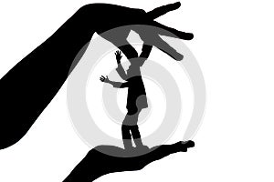 Silhouette female holding male by fingers behind the scruff as a puppet on white isolated background