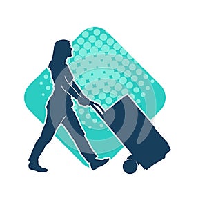 Silhouette of a female worker pushing lori wheels transporting carboard boxes.