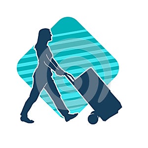 Silhouette of a female worker pushing lori wheels transporting carboard boxes.