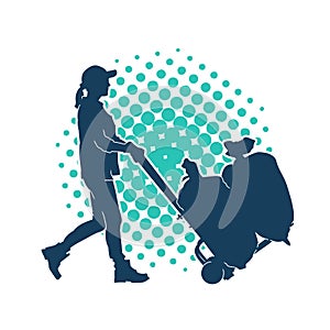 Silhouette of a female worker pushing lori wheels transporting sacks