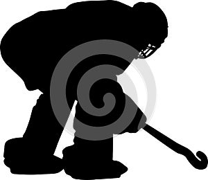 Silhouette of field hockey player with a hockey stick