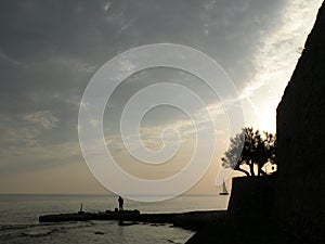 Silhouette figure at the sea. Background for peace, meditation, holidays,lifestyle