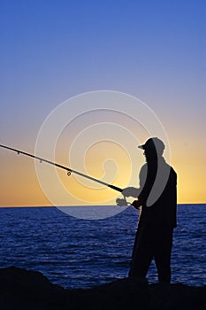 Silhouette of Fisherman photo