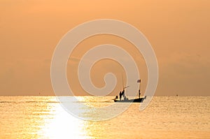 Silhouette fisherman boat on the sea in morning