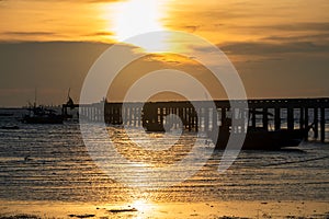 Silhouette fisherman boats and bridge at sunset, Chonburi