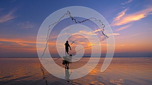 Silhouette Fisherman fishing nets on the boat. Silhouette of fishermen using coop-like trap catching fish in lake with beautiful s