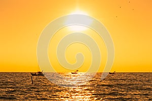 Silhouette of fisherman ship and beautiful sky and sunset.