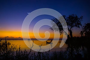 Silhouette of Fisherman and son with twilight sky