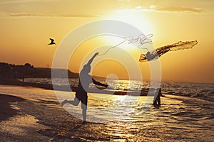 Silhouette of a fisherman at sunset throwing a fishing net