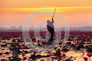 The silhouette fisherman working on the boat