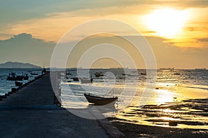 Silhouette fishing boats and bridge dock at sunset, Chonburi