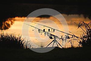 Silhouette of a fishing rod pod