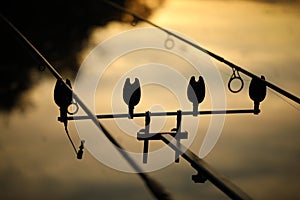 Silhouette of a fishing rod pod