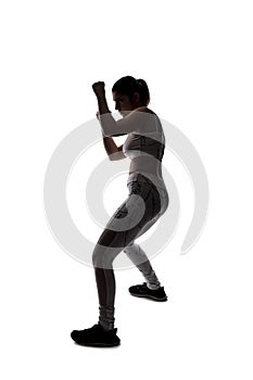 Silhouette of a Fit Woman In a Fighting Stance