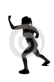 Silhouette of a Fit Woman In a Fighting Stance