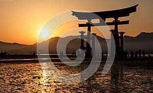 Silhouette of floating Torii Gate at sunset, Miyajima island, Hi
