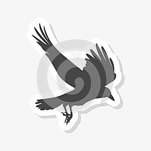 Silhouette of a flying crow isolated on white sticker