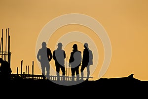 Silhouette of engineers at construction site