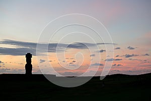 Silhouette of a giant statue of Easter Island at sunset. The moai of Ahu Ko Te Riku, Hanga Roa, Easter Island, Chile