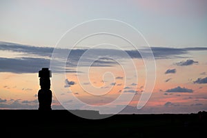 Silhouette of a giant statue of Easter Island at sunset. The moai of Ahu Ko Te Riku, Hanga Roa, Easter Island, Chile