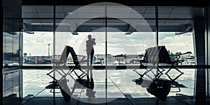 Silhouette of a girl in an airport terminal