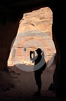 Silhouette of girl in cave