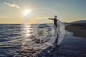 Silhouette of a girl enjoying in the summer