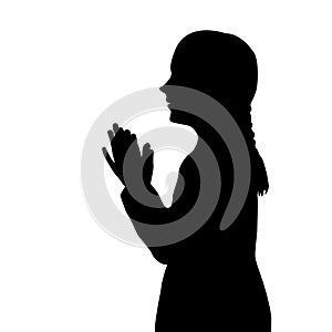 Silhouette of a girl praying