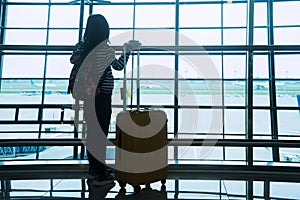 Silhouette girl standing in airport