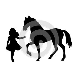 Silhouette girl wants touch horse