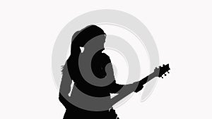 Silhouette of a girl who plays the guitar. On a white background. Record a music video.