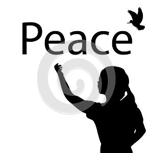 Silhouette of girl writing the word peace.